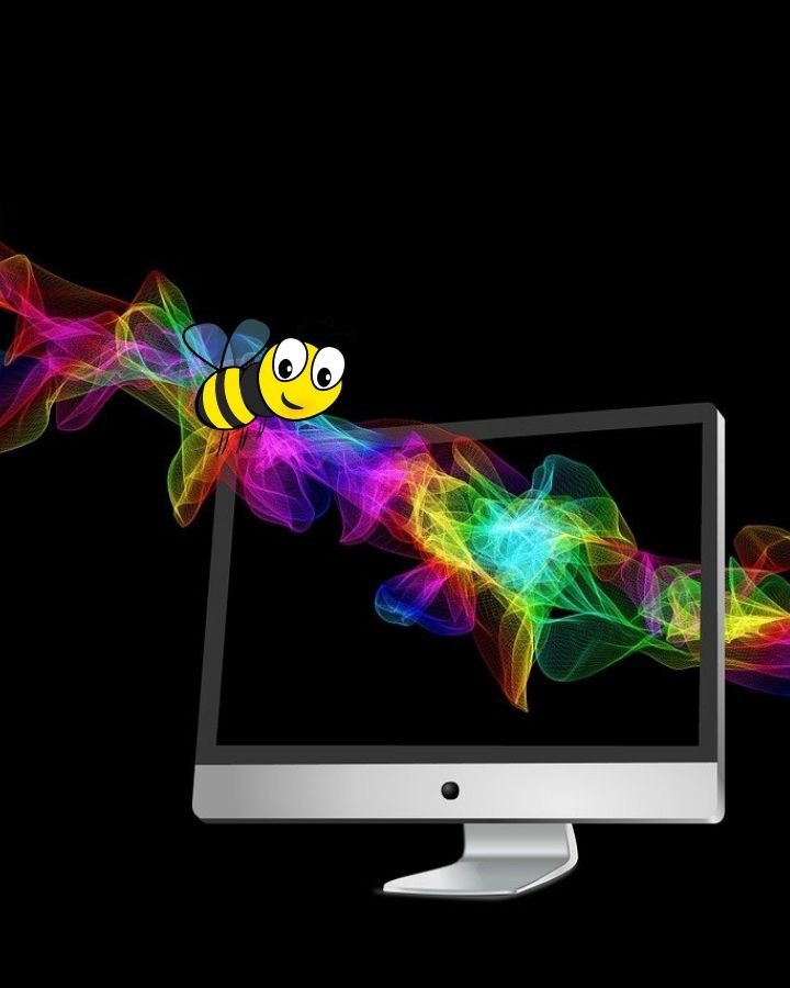 Un computer su sfondo nero: lo schermo è attraversato da un fascio luminoso sul quale vola una piccola ape